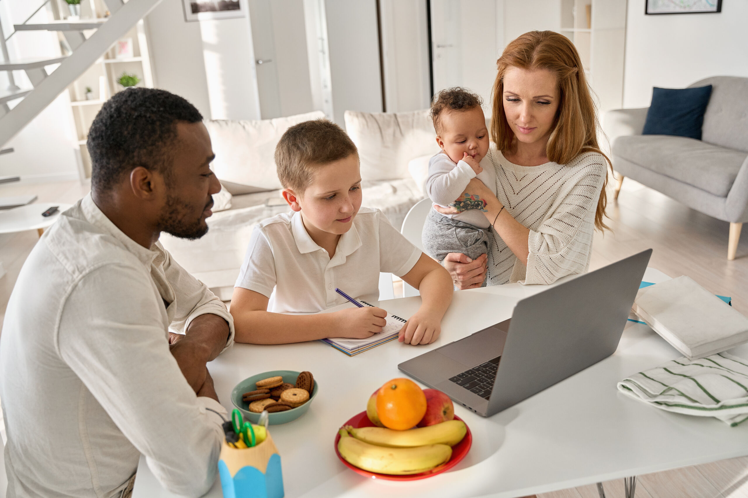 Parents helping their children with schoolwork at home